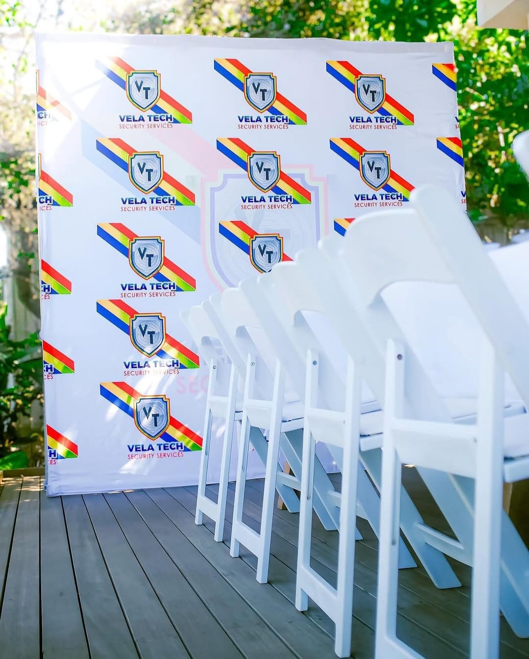 Vela-Tech Security branded backdrop banner set up at a company event